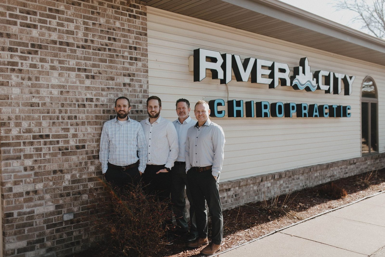 The chiropractors of River City Chiropractic outside their Onalaska clinic